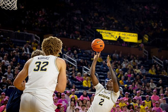 Malick Kordel (32) and L.J. Cason (2)