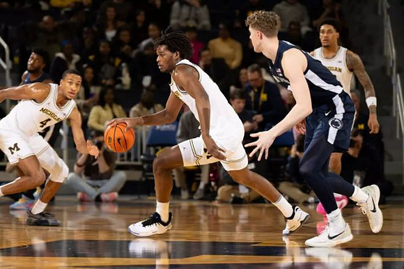 Nimari Burnett (4), Morez Johnson Jr. (21), and Yaxel Lendeborg (23)