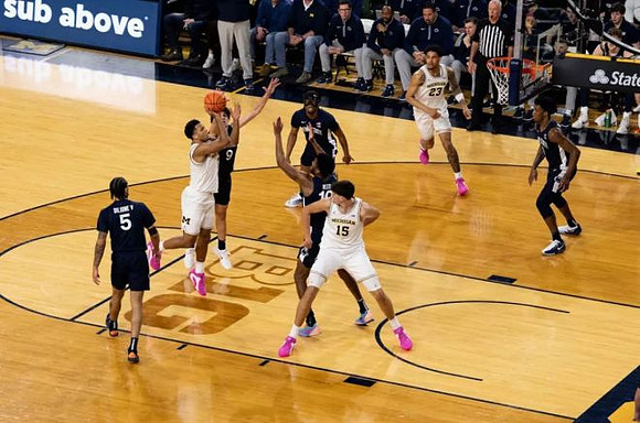 Trey McKenney (1), Aday Mara (15), and Yaxel Lendeborg (23)