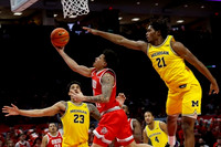 Yaxel Lendeborg (23), Nimari Burnett (4), and Morez Johnson Jr. (21)