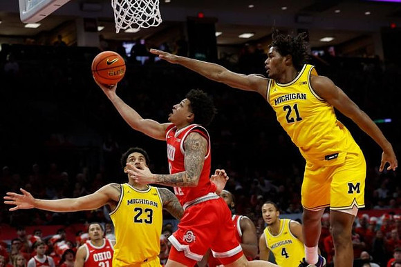 Yaxel Lendeborg (23), Nimari Burnett (4), and Morez Johnson Jr. (21)