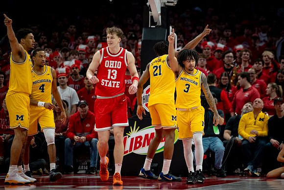 Yaxel Lendeborg (23), Nimari Burnett (4), Morez Johnson Jr. (21), and Elliot Cadeau (3)