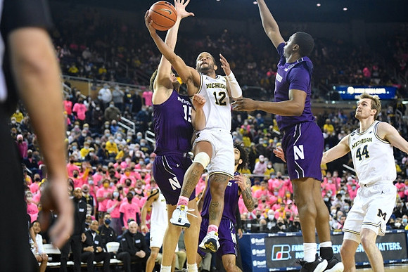 DeVante' Jones (12) and Jaron Faulds (44)