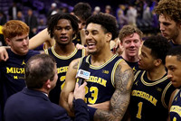 Yaxel Lendeborg (23) and Michigan Team