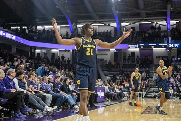 Morez Johnson Jr. (21), Yaxel Lendeborg (23), and Nimari Burnett (4)