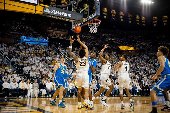Yaxel Lendeborg (23), Morez Johnson Jr. (21), and Nimari Burnett (4)