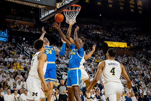 Yaxel Lendeborg (23), Morez Johnson Jr. (21), and Nimari Burnett (4)