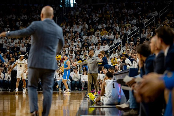 Roddy Gayle Jr. (11), UCLA Head Coach Mick Cronin, Dusty May, and Trey McKenney (1)
