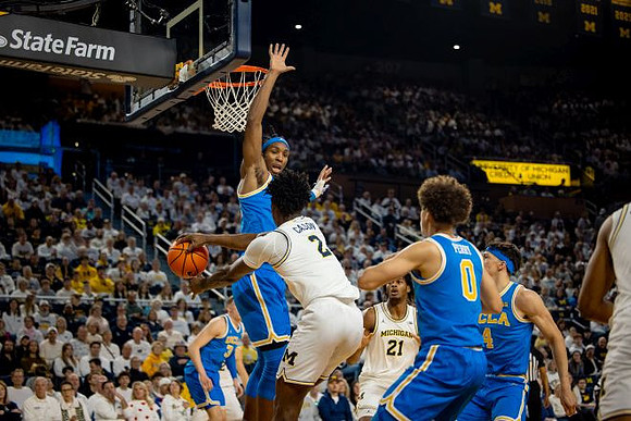 L.J. Cason (2) and Morez Johnson Jr. (21)