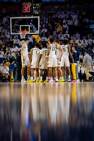 Aday Mara (15), Trey McKenney (1), L.J. Cason (2), Yaxel Lendeborg (23), and Morez Johnson Jr. (21)