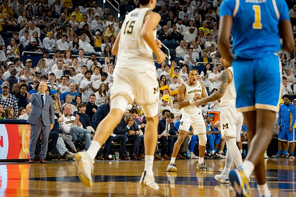 UCLA Head Coach Mick Cronin, Aday Mara (15), Nimari Burnett (4), and Elliot Cadeau (3)