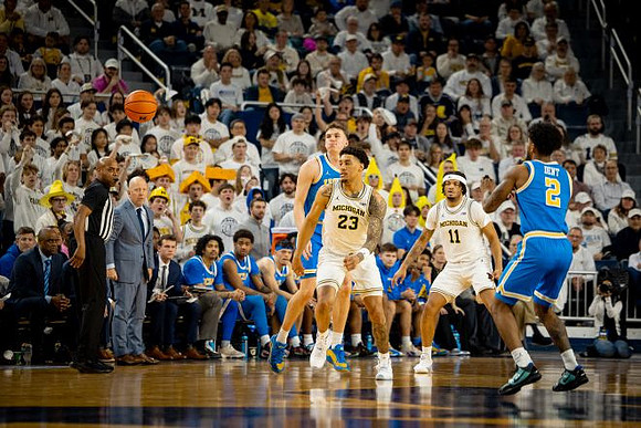 UCLA Head Coach Mick Cronin, Yaxel Lendeborg (23), and Roddy Gayle Jr. (11)