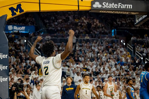 L.J. Cason (2) and Michigan Team