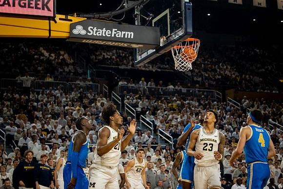 Morez Johnson Jr. (21), Will Tschetter (42), and Yaxel Lendeborg (23)