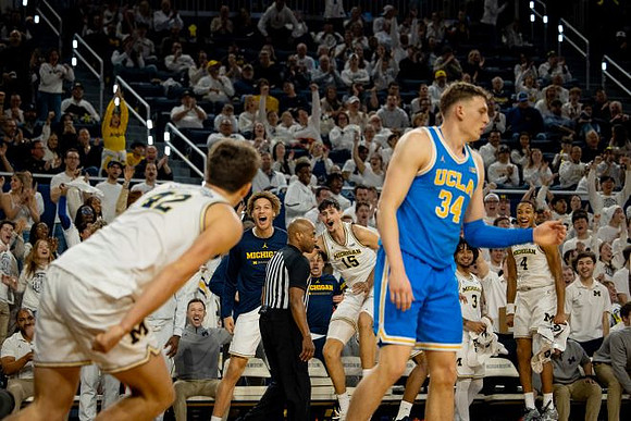 Will Tschetter (42) and Michigan Team