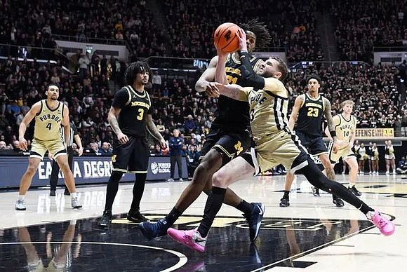 Elliot Cadeau (3), Morez Johnson Jr. (21), Yaxel Lendeborg (23), and Ricky Liburd (0)