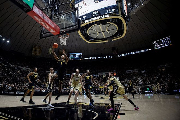 Yaxel Lendeborg (23), Trey McKenney (1), Morez Johnson Jr. (21), and Elliot Cadeau (3)