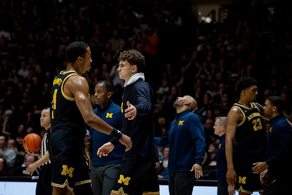 Nimari Burnett (4), Will Tschetter (42), and Yaxel Lendeborg (23)
