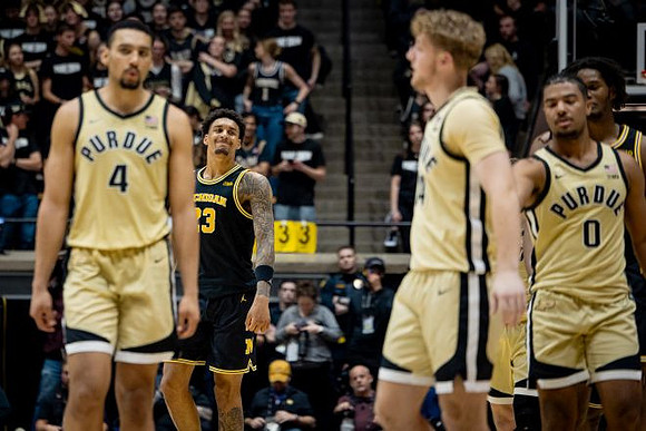 Yaxel Lendeborg (23) and Morez Johnson Jr. (21)