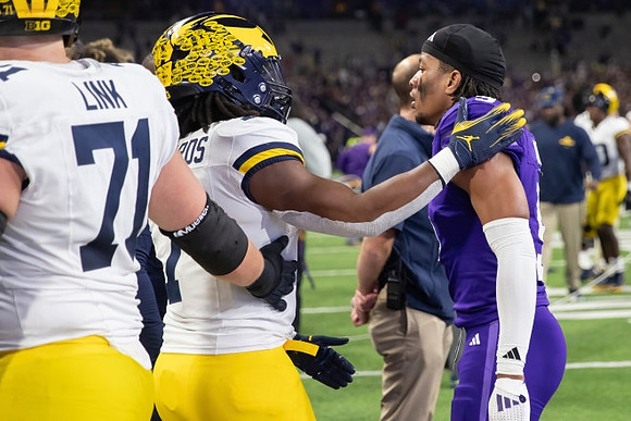 Evan Link (71) and Donovan Edwards (7)