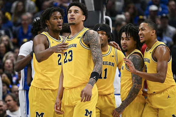 Morez Johnson Jr. (21), Yaxel Lendeborg (23), Roddy Gayle Jr. (11), Elliot Cadeau (3), and Nimari Burnett (4)