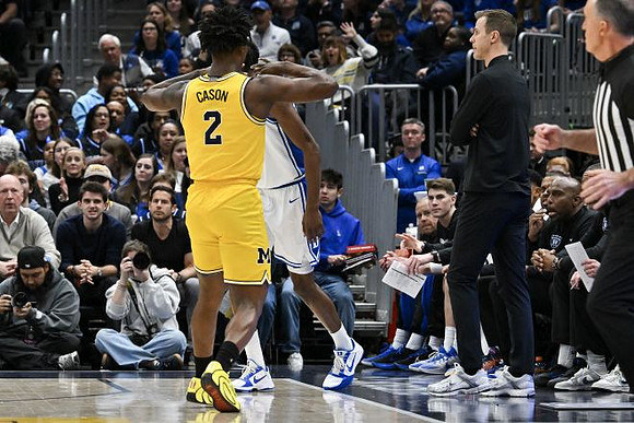 L.J. Cason (2) and Duke Head Coach Jon Scheyer
