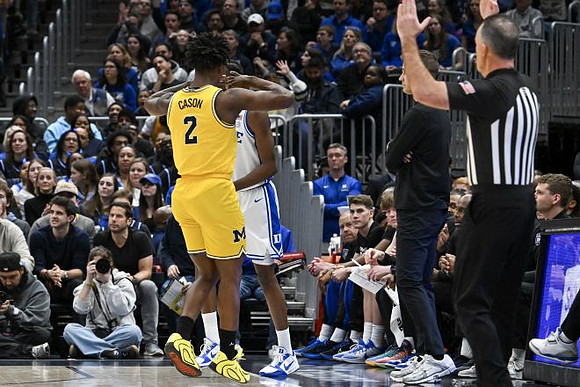 L.J. Cason (2) and Duke Head Coach Jon Scheyer