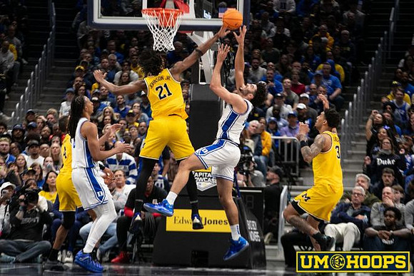 Nimari Burnett (4), Morez Johnson Jr. (21), and Yaxel Lendeborg (23)