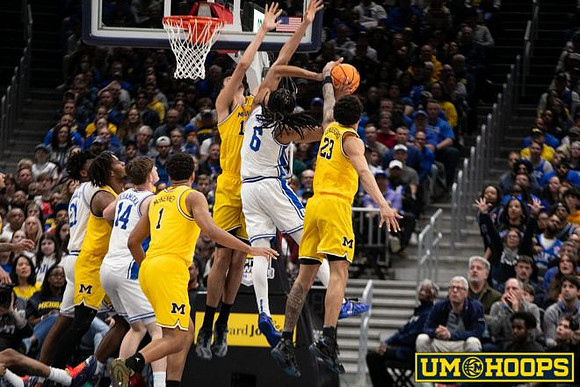 Morez Johnson Jr. (21), Trey McKenney (1), Aday Mara (15), and Yaxel Lendeborg (23)