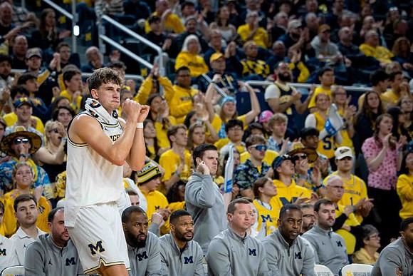 Will Tschetter (42) and Michigan Team