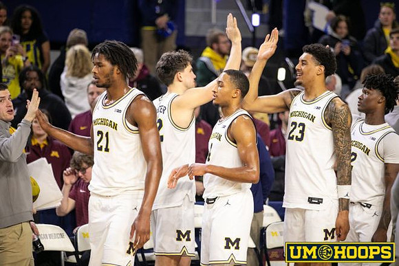 Morez Johnson Jr. (21), Will Tschetter (42), Nimari Burnett (4), Yaxel Lendeborg (23), and L.J. Cason (2)