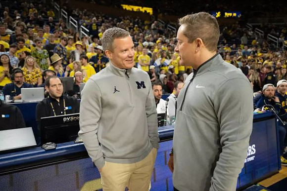 Dusty May and Minnesota Head Coach Niko Medved