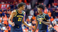 Morez Johnson Jr. (21) and L.J. Cason (2)