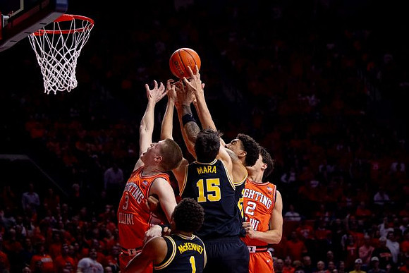 Trey McKenney (1), Aday Mara (15), and Yaxel Lendeborg (23)
