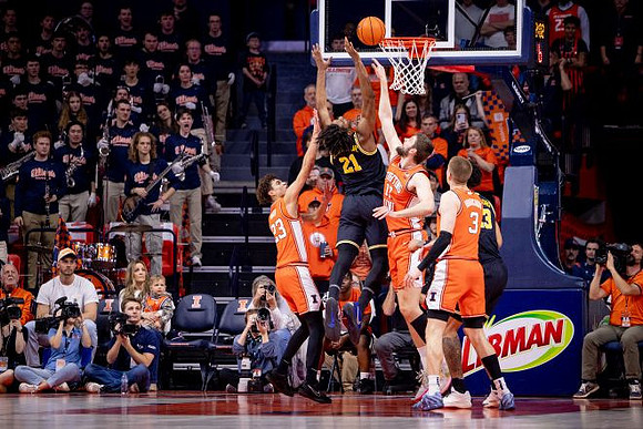 Morez Johnson Jr. (21), Yaxel Lendeborg (23), and Ricky Liburd (0)