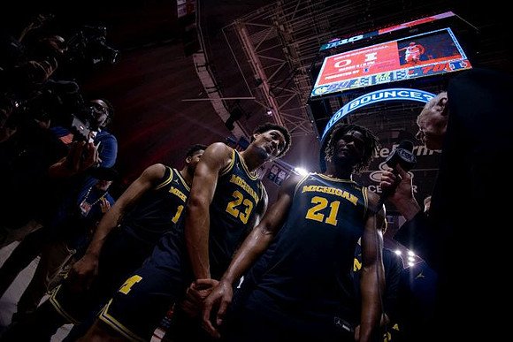 Trey McKenney (1), Yaxel Lendeborg (23), and Morez Johnson Jr. (21)