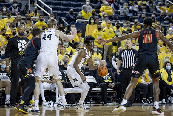 Juwan Howard, Jaron Faulds (44), and Jace Howard (25)