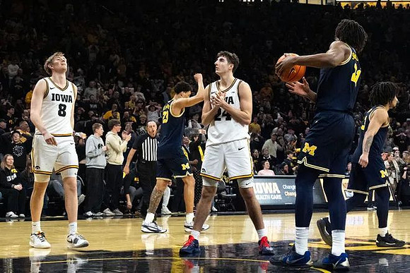 Yaxel Lendeborg (23), Morez Johnson Jr. (21), and Elliot Cadeau (3)