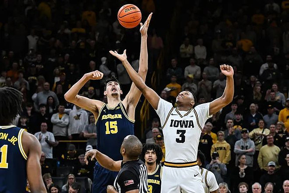 Morez Johnson Jr. (21), Aday Mara (15), and Elliot Cadeau (3)