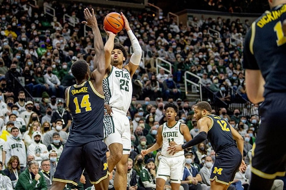 Moussa Diabate (14), DeVante' Jones (12), and Hunter Dickinson (1)