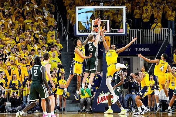 Will Tschetter (42), Yaxel Lendeborg (23), Morez Johnson Jr. (21), Trey McKenney (1), and Nimari Burnett (4)