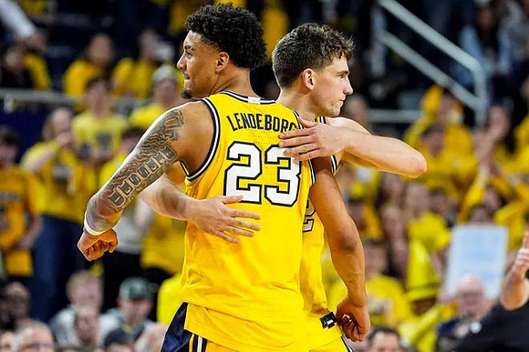 Yaxel Lendeborg (23) and Will Tschetter (42)