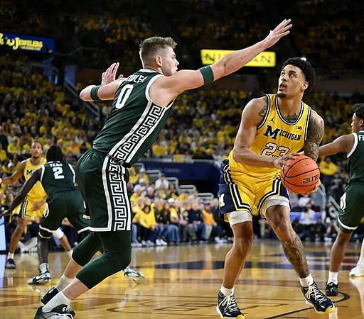 Yaxel Lendeborg (23) and Nimari Burnett (4)
