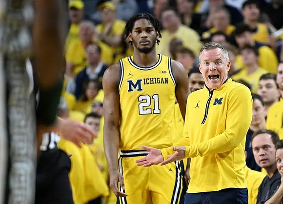 Morez Johnson Jr. (21) and Dusty May