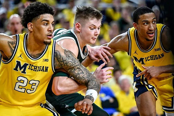 Yaxel Lendeborg (23) and Nimari Burnett (4)