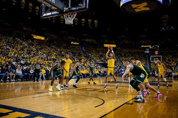 Roddy Gayle Jr. (11), Yaxel Lendeborg (23), Will Tschetter (42), and Nimari Burnett (4)