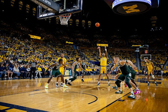 Roddy Gayle Jr. (11), Yaxel Lendeborg (23), and Nimari Burnett (4)