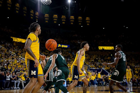 Roddy Gayle Jr. (11), Yaxel Lendeborg (23), and Ricky Liburd (0)