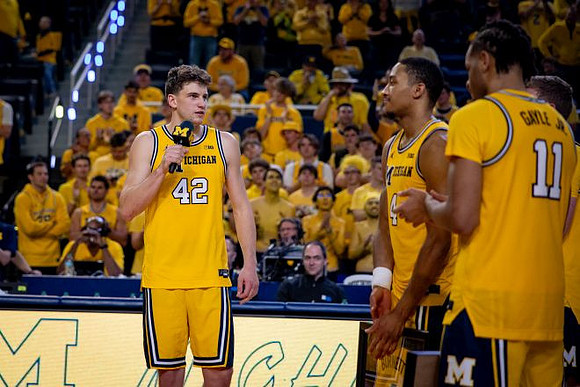 Will Tschetter (42), Nimari Burnett (4), and Roddy Gayle Jr. (11)