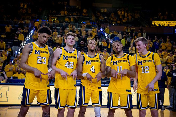 Yaxel Lendeborg (23), Will Tschetter (42), Nimari Burnett (4), Roddy Gayle Jr. (11), and Charlie May (12)